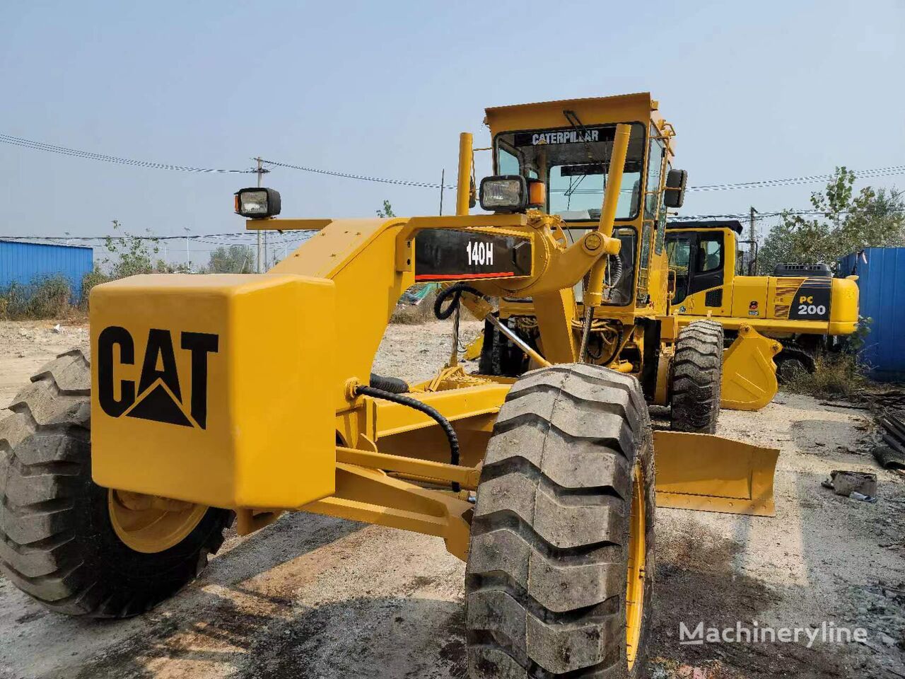 грейдер Caterpillar 140H