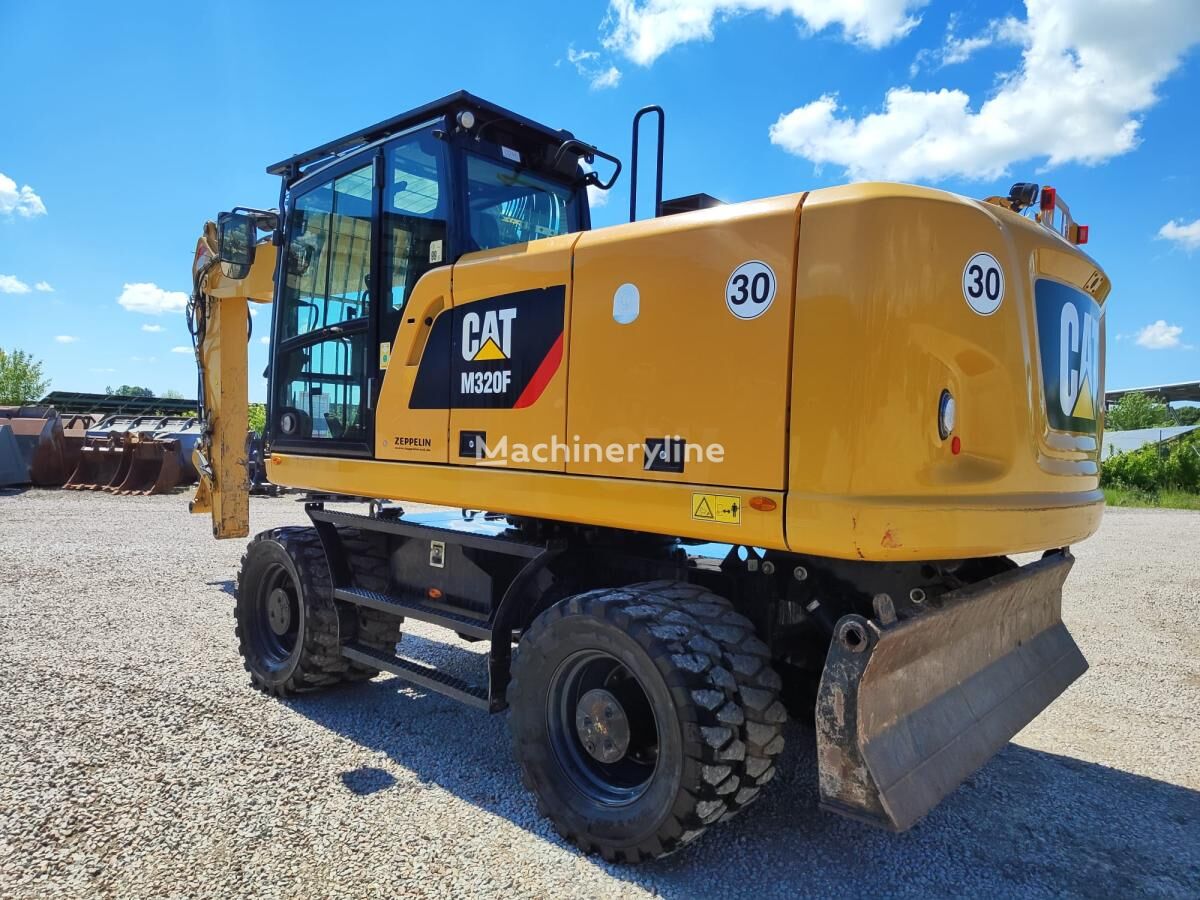 колесный экскаватор Caterpillar M320F